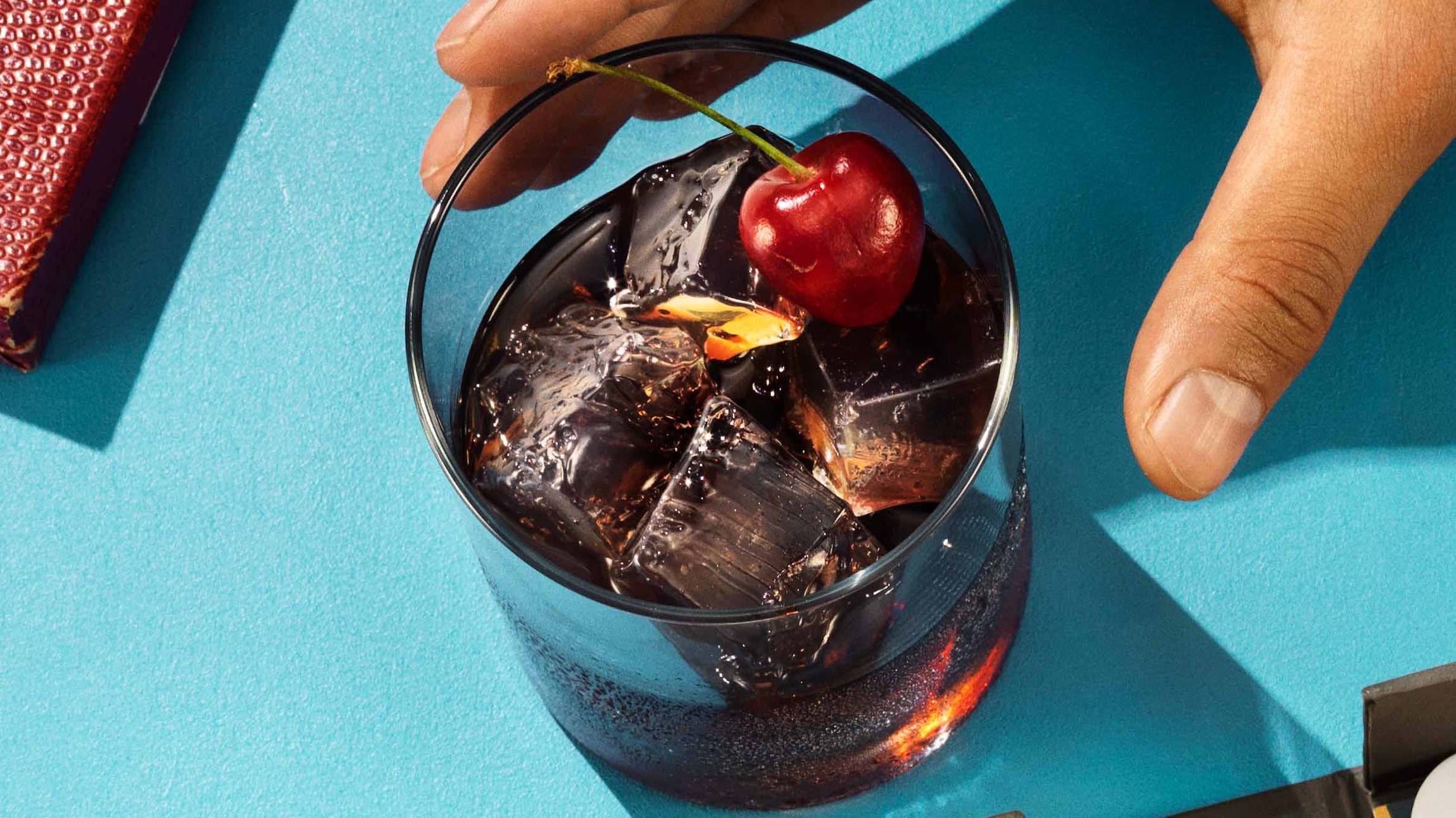 Black russian cocktail on a blue table