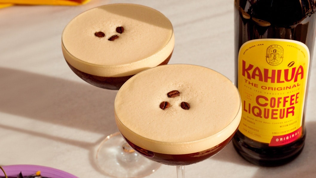 Two espresso martini cocktails on a table